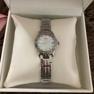 Guess women’s watch, mother of pearl background
